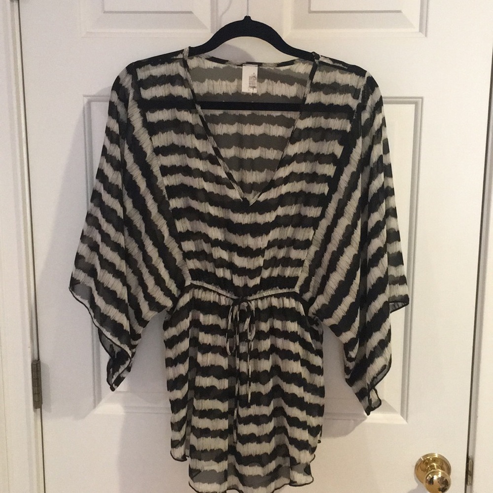 Francesca’s sheer bell sleeve top!